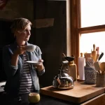 women drinks coffee in her home